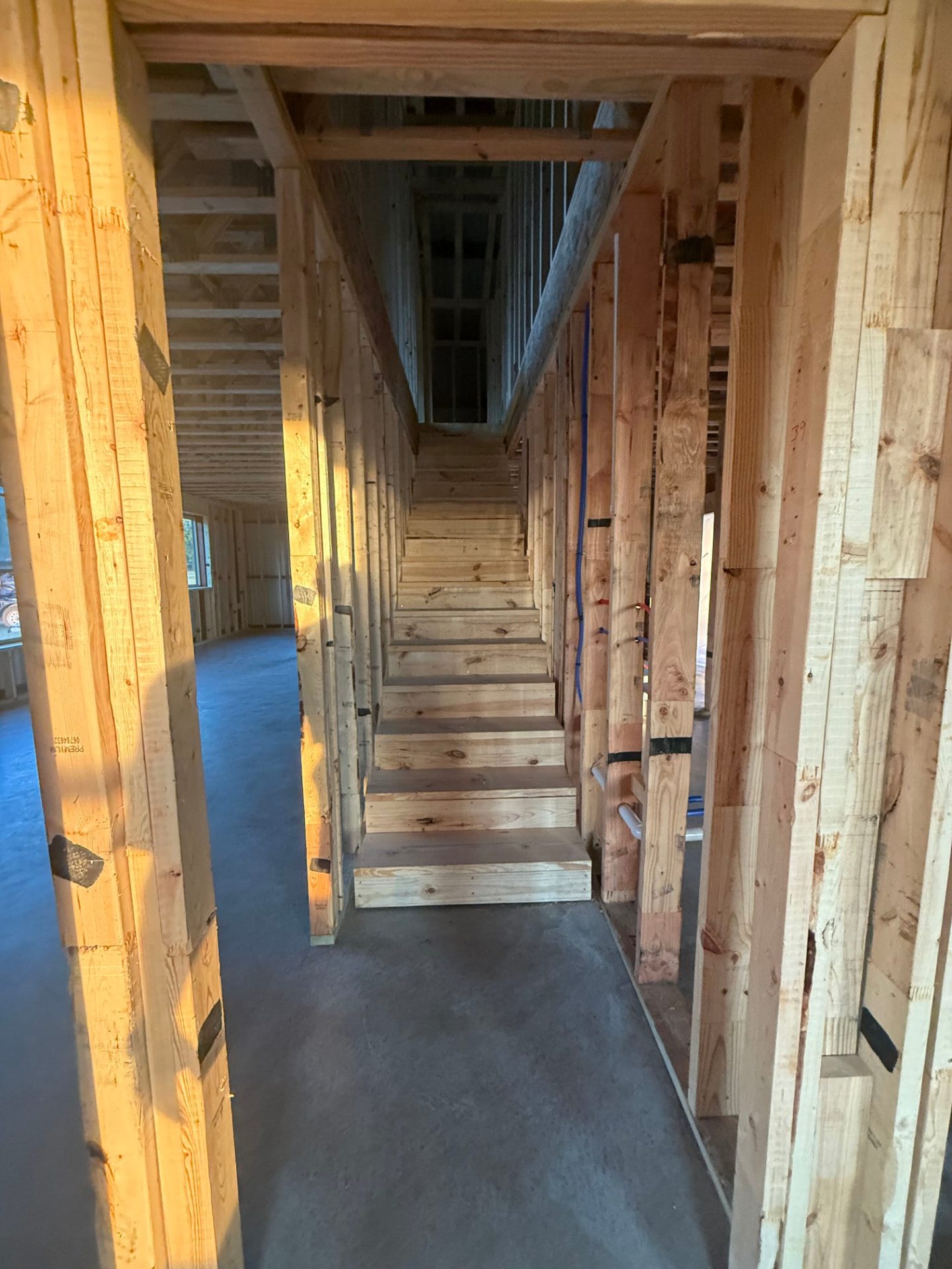 Interior hallway and stair framing during construction of a custom home